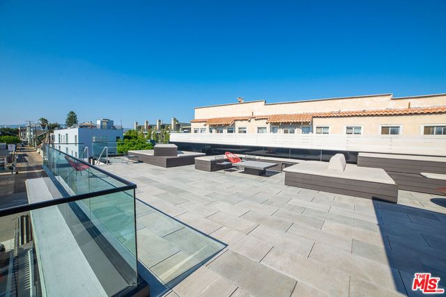 a view of a terrace with seating area