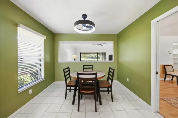a view of a dining room with furniture and a window