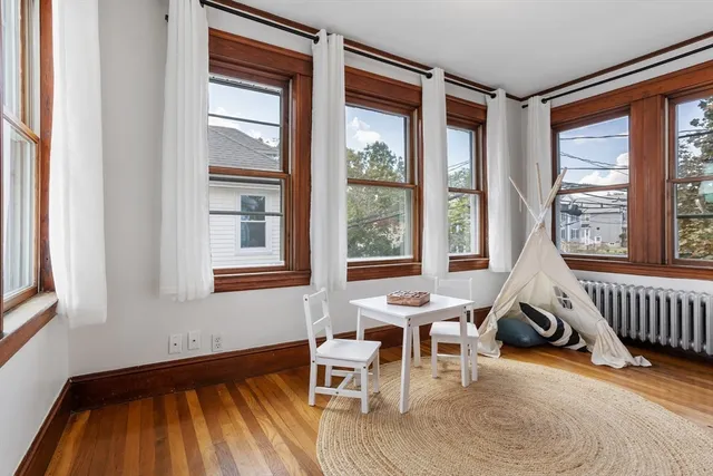 a living room filed with furniture and a window
