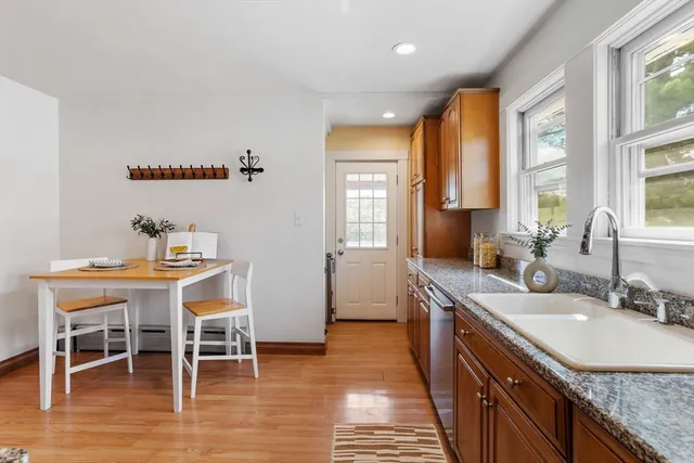 a kitchen with granite countertop a sink and a stove