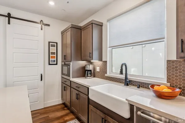 a kitchen with a sink and a refrigerator