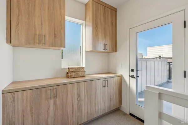 a kitchen with a sink and cabinets