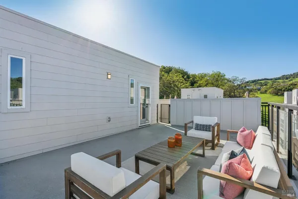 swimming pool view with a seating space