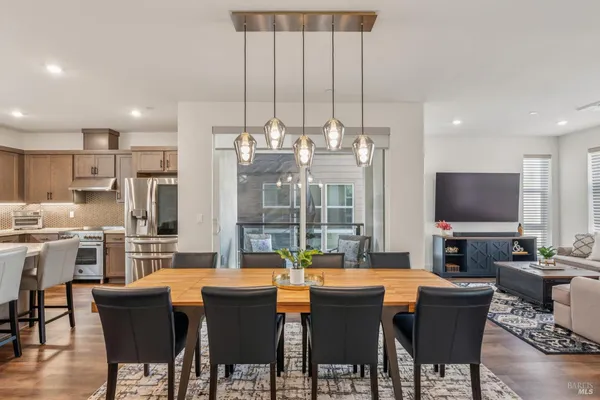 a view of a dining room with furniture window and wooden floor