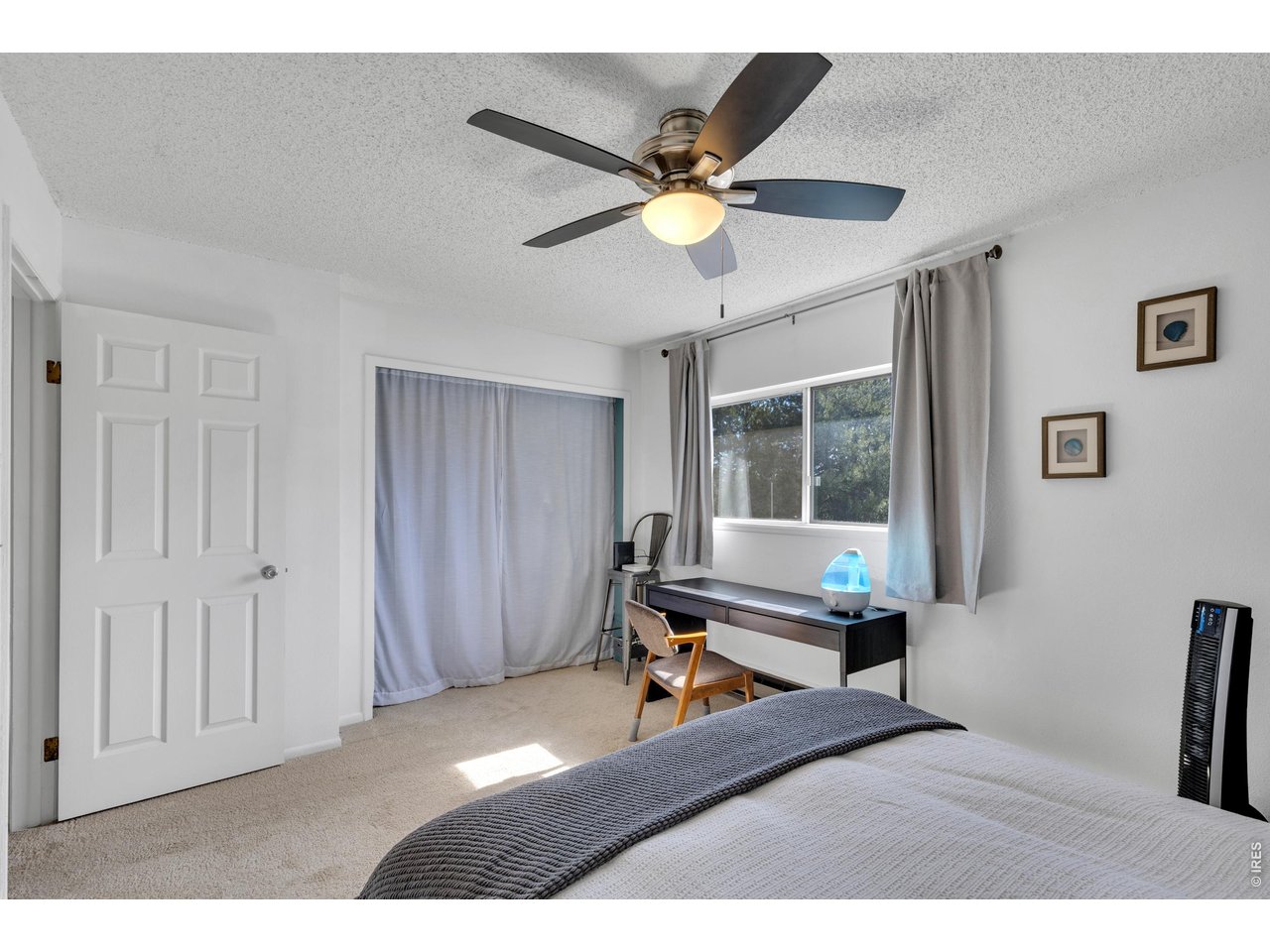 1024 East Swallow Road, Unit 234 Fort Collins, CO 80525 - Photo 12 of 21 a living room with a bed furniture and a window
