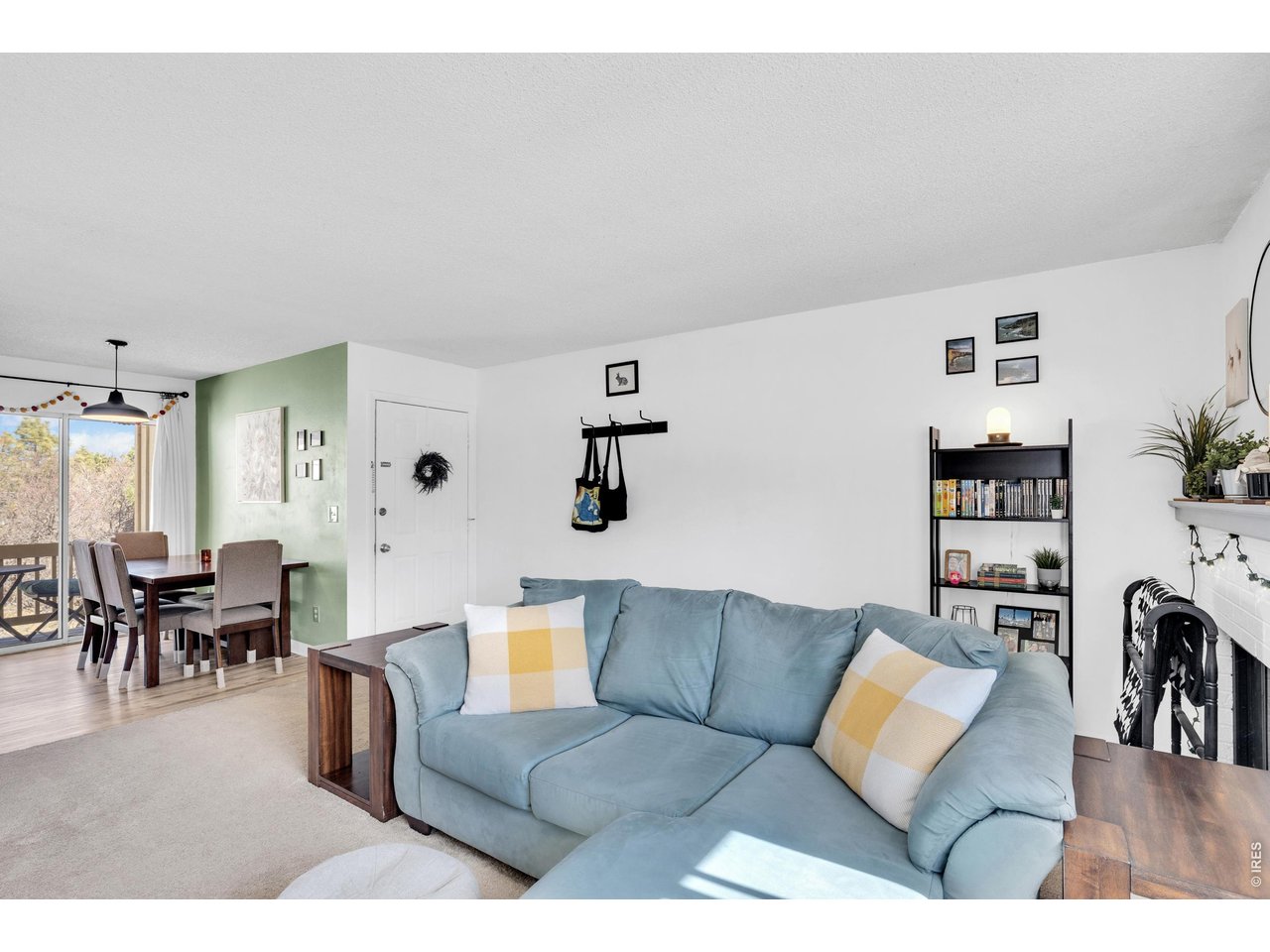 1024 East Swallow Road, Unit 234 Fort Collins, CO 80525 - Photo 4 of 21 a living room with furniture and wooden floor