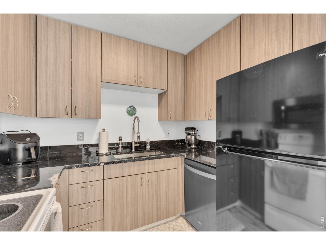 1024 East Swallow Road, Unit 234 Fort Collins, CO 80525 - Photo 8 of 21 a kitchen with a sink a stove and cabinets