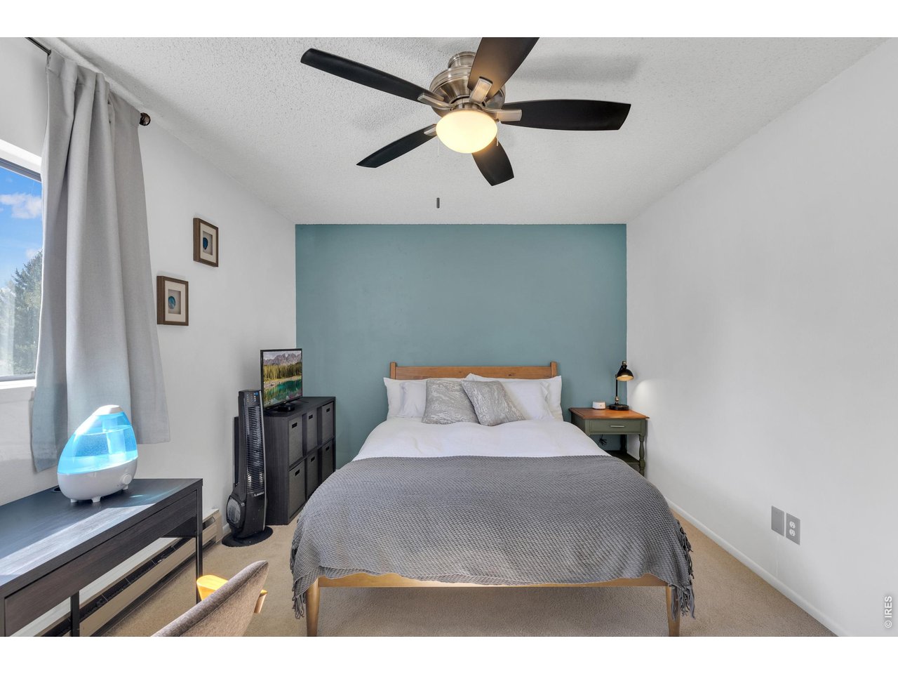 1024 East Swallow Road, Unit 234 Fort Collins, CO 80525 - Photo 10 of 21 a bedroom with a bed and a dresser in it