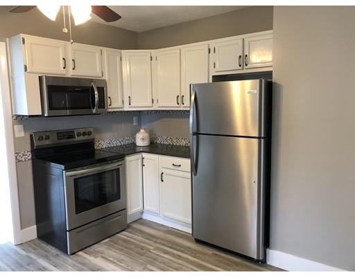 14 Off Bourne Street Three Rivers, MA 01080 - Photo 11 of 29 a kitchen with cabinets stainless steel appliances and wooden floor