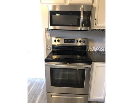 14 Off Bourne Street Three Rivers, MA 01080 - Photo 15 of 29 a kitchen with a stove and a microwave