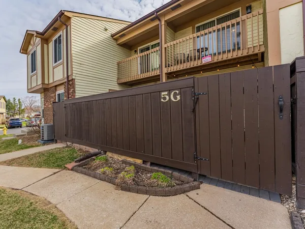 an aerial view of a house with swimming pool yard and outdoor seating