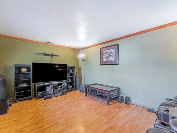 a bedroom with furniture and stairs