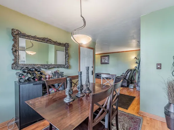 a kitchen with granite countertop a refrigerator stove and microwave