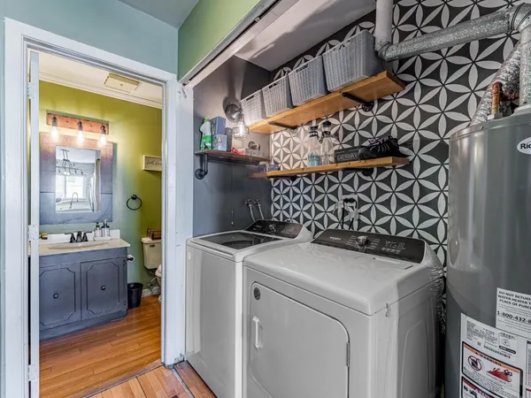 a bathroom with a sink mirror vanity and toilet