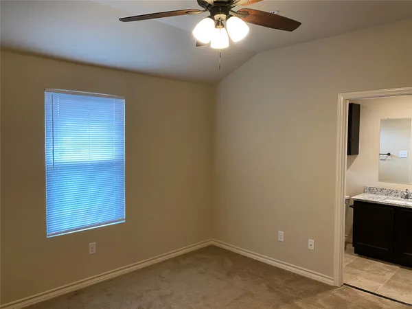 an empty room with closet area