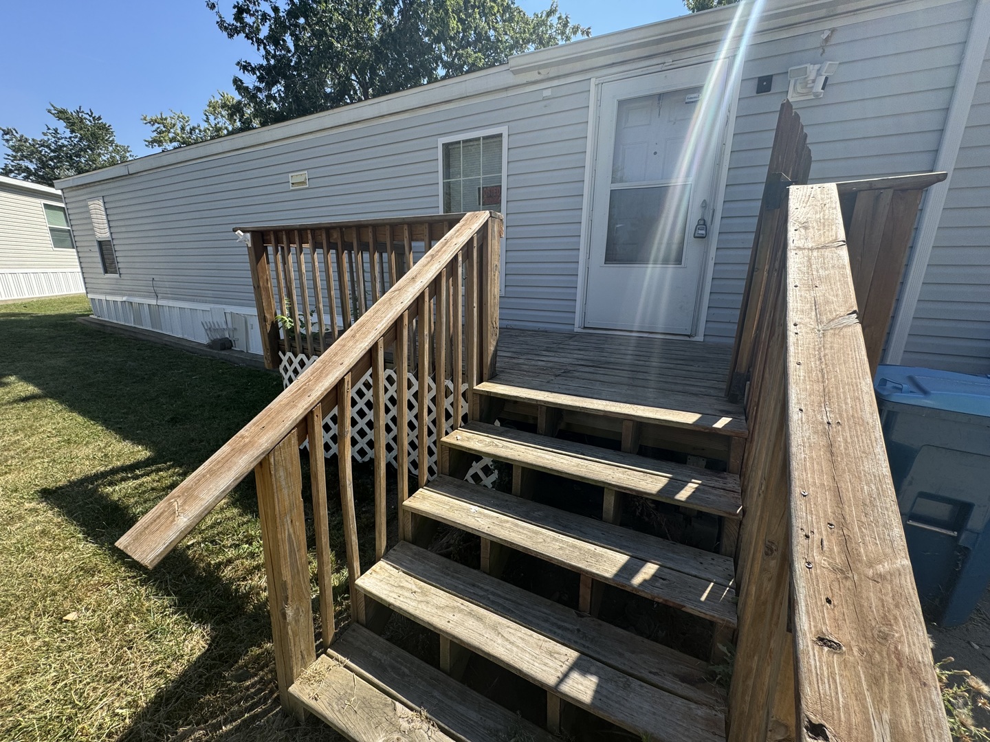 a view of deck with wooden floor and fence and a potted plant