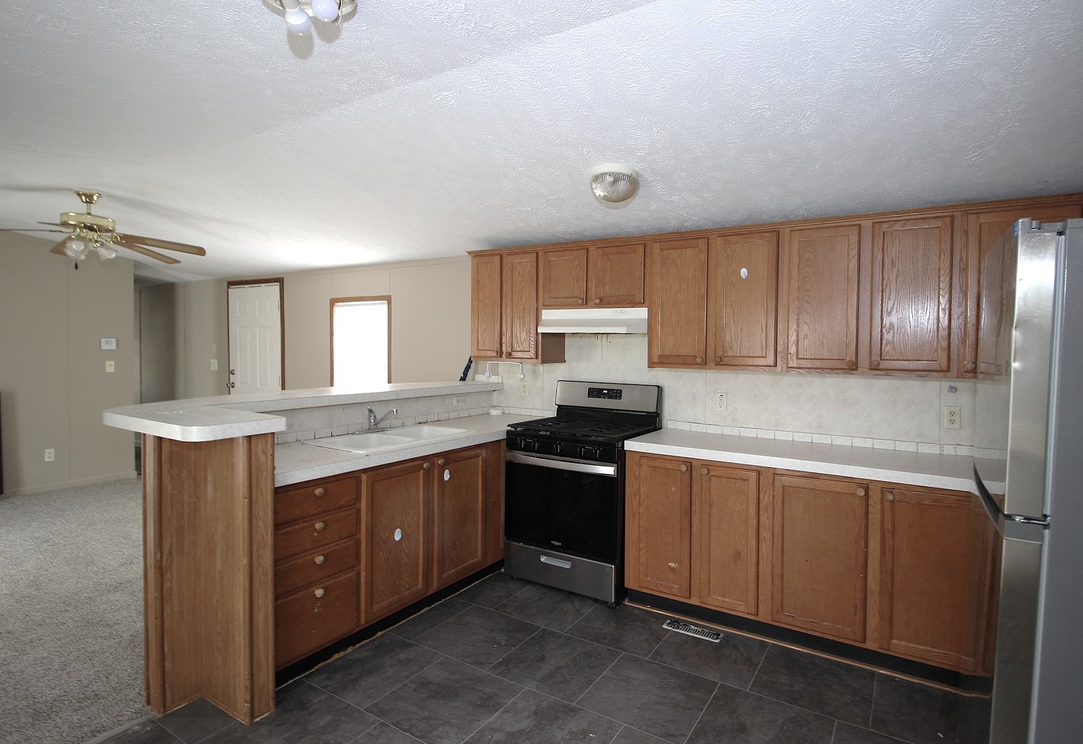 1804 C Street Normal, IL 61761 - Photo 6 of 14 a kitchen with stainless steel appliances granite countertop a sink and cabinets