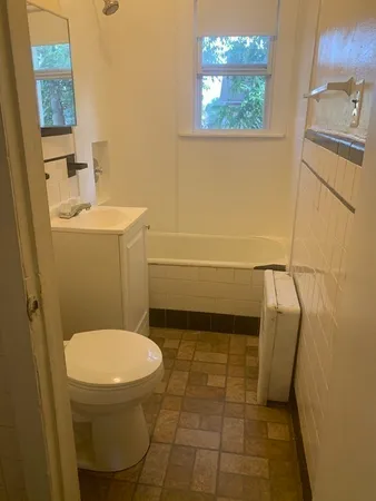 a bathroom with a toilet and a sink