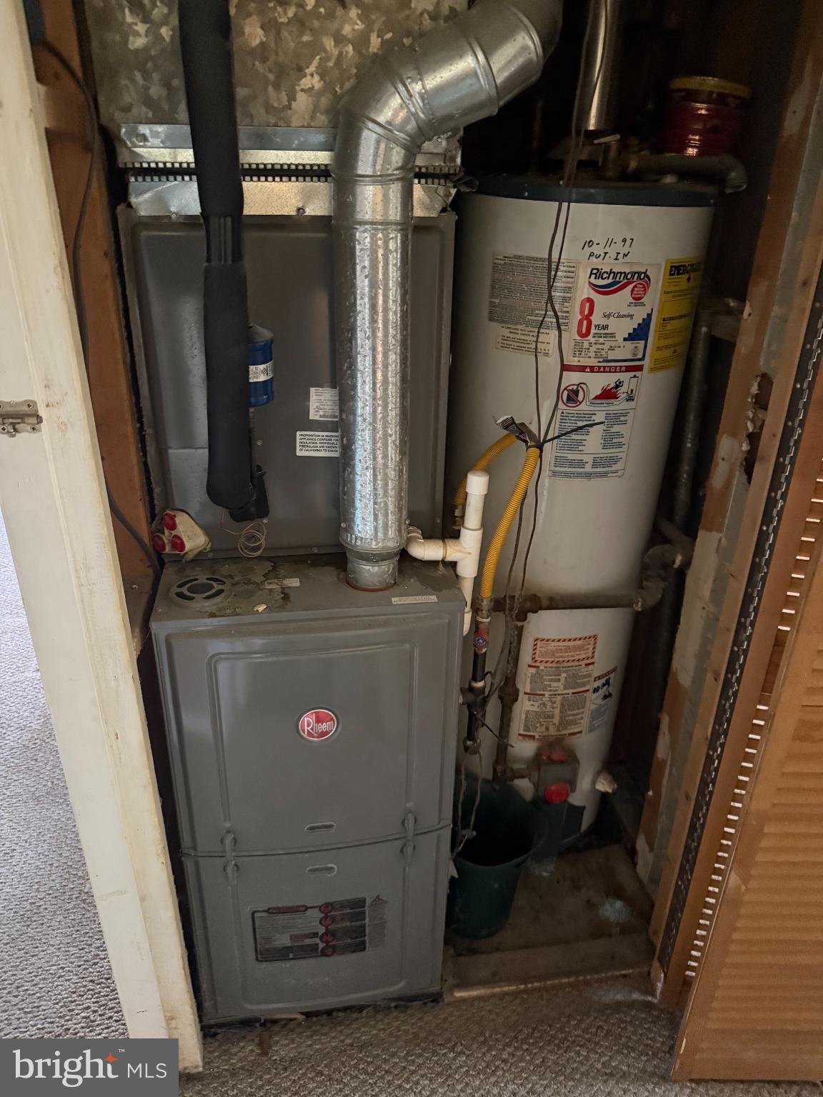 111 Ridge Avenue Baltimore, MD 21227 - Photo 9 of 10 Utility space with heating and water systems.