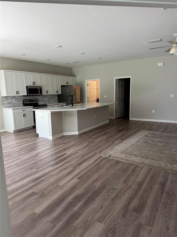 5515 Southeast 91st Street Ocala, FL 34480 - Photo 15 of 40 a view of kitchen with sink microwave and cabinets