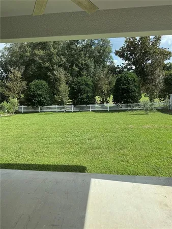 a view of a room with wooden floor wooden floor and outdoor space