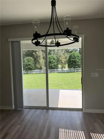 a view of kitchen with stainless steel appliances cabinets and wooden floor