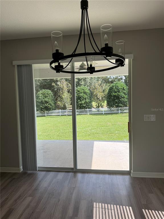 5515 Southeast 91st Street Ocala, FL 34480 - Photo 23 of 40 a view of a room with wooden floor wooden floor and outdoor space
