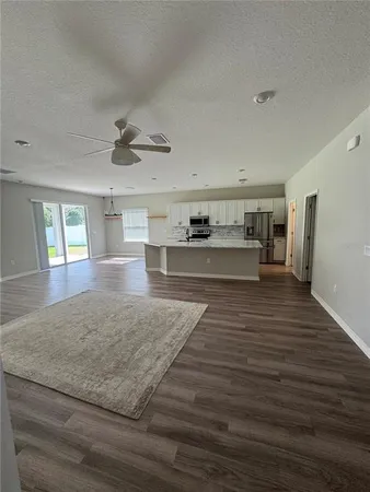 an empty room with windows and entrance