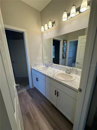 an empty room with closet and mirror
