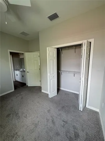 an empty room with a empty space and a window