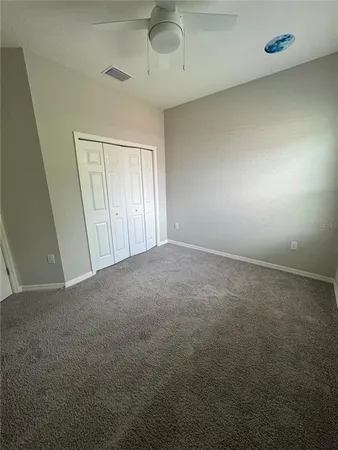 a view of a room with wooden floor and staircase