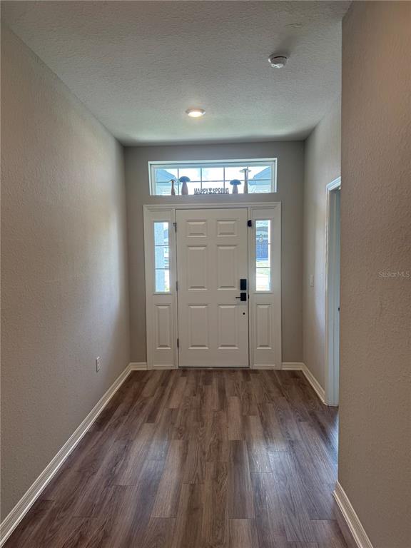5515 Southeast 91st Street Ocala, FL 34480 - Photo 34 of 40 an empty room with wooden floor and windows