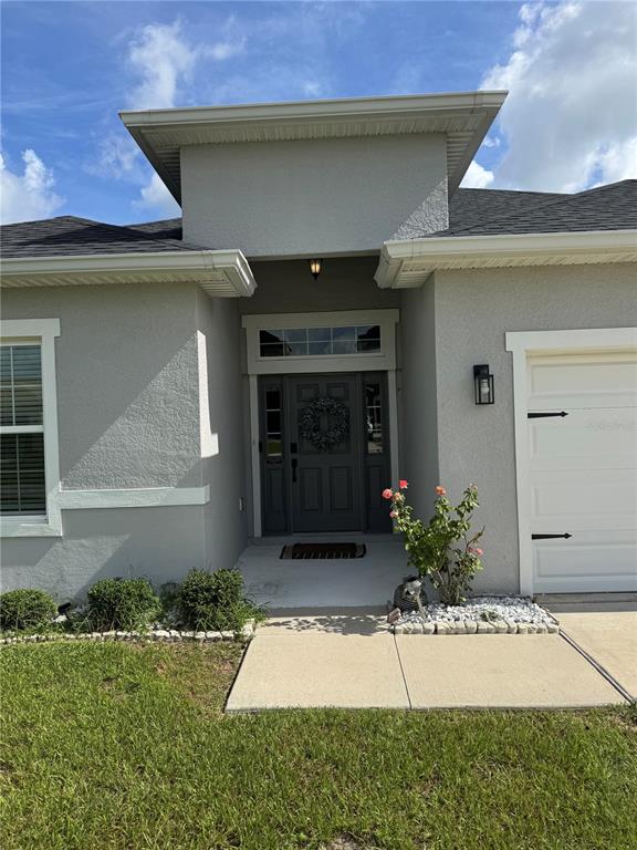 5515 Southeast 91st Street Ocala, FL 34480 - Photo 39 of 40 a front view of a house with garden