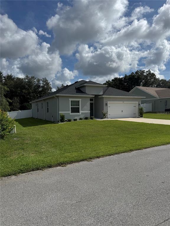 5515 Southeast 91st Street Ocala, FL 34480 - Photo 40 of 40 a view of house with a big yard and potted plants