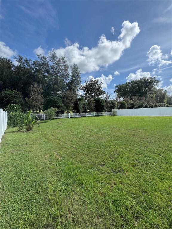5515 Southeast 91st Street Ocala, FL 34480 - Photo 5 of 40 a view of a golf course with a lake