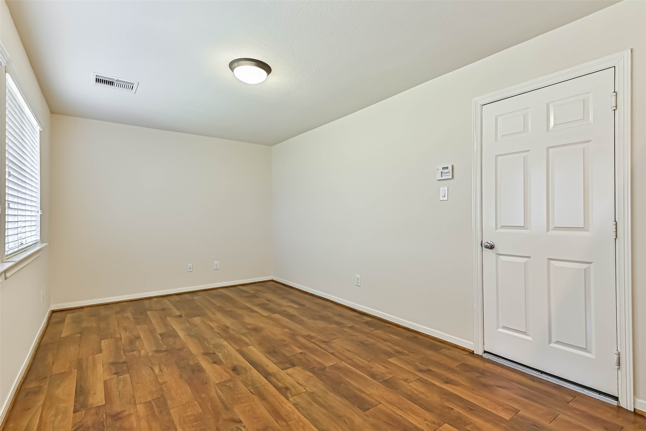 3208 Clearview Circle Houston, TX 77025 - Photo 7 of 30 wooden floor in an empty room