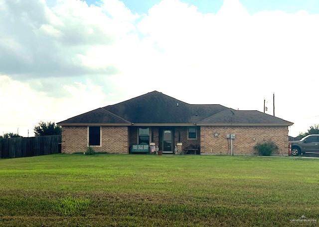 21811 Cragon Road Harlingen, TX 78552 - Photo 1 of 1 Back of property with a lawn
