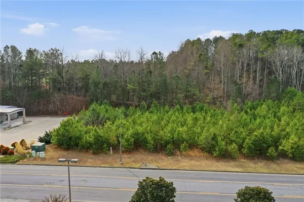 a view of a yard and trees