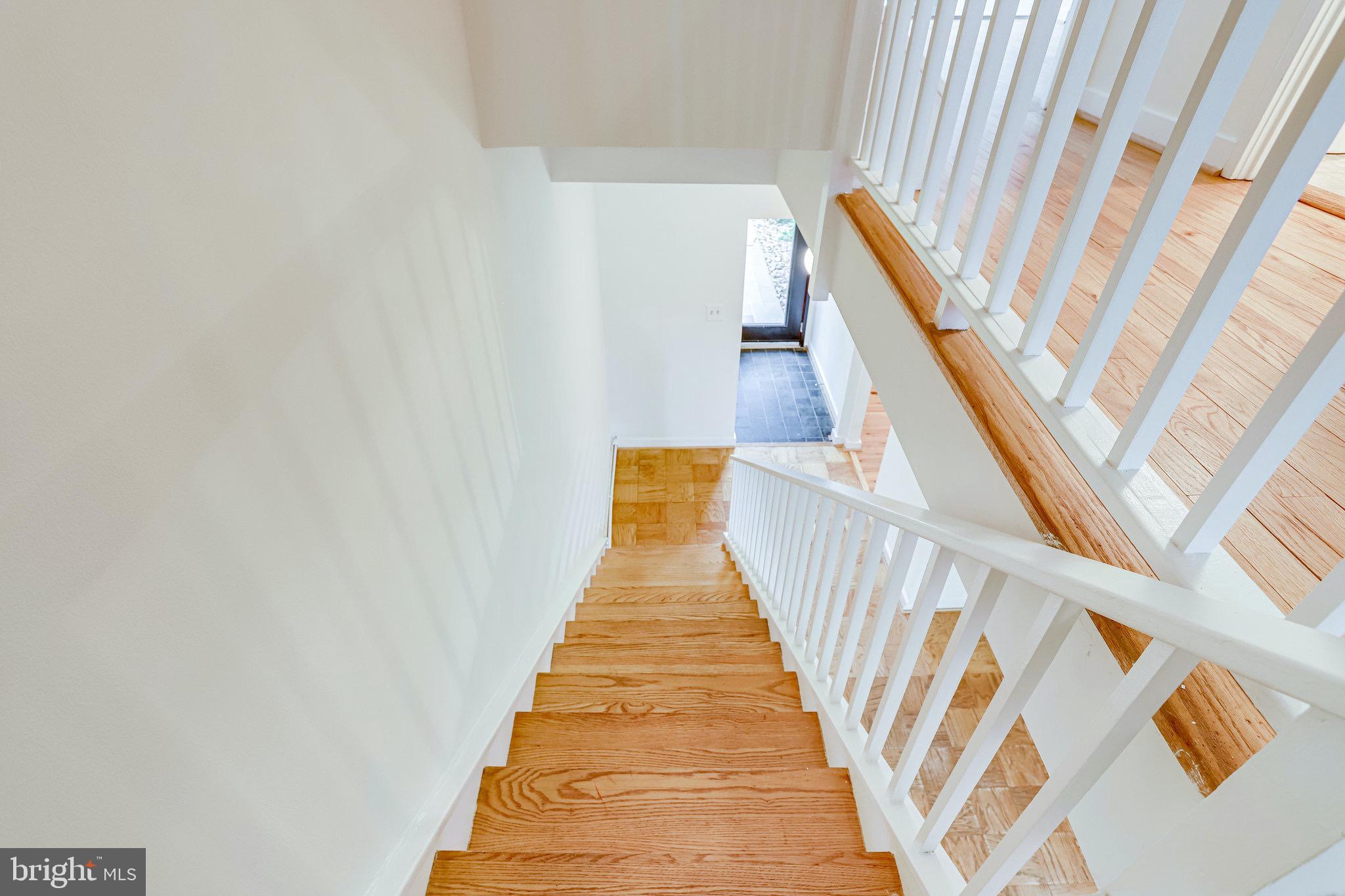 11455 Waterview Cluster Reston, VA 20190 - Photo 23 of 74 Sleek Staircase Leads to the Two Upper Levels!