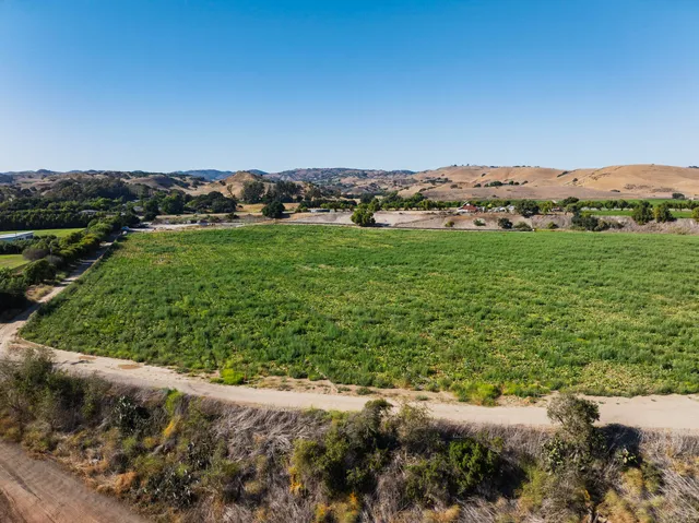 an aerial view of a house with a garden
