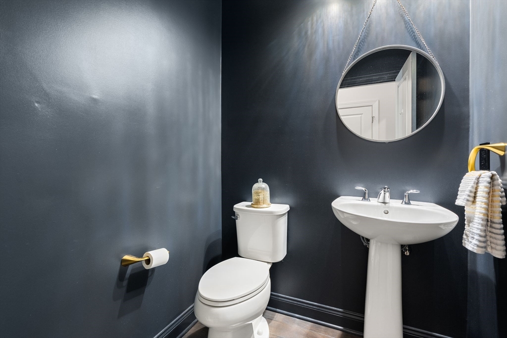 2 Hummingbird Way, Unit 1 Methuen, MA 01844 - Photo 22 of 42 a bathroom with a toilet sink and mirror