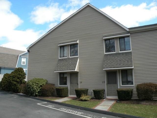 377 Glenbrook Road, Unit 14 Stamford, CT 06906 - Photo 1 of 1 a front view of a house with a yard