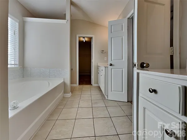 a bathroom with a bathtub and shower