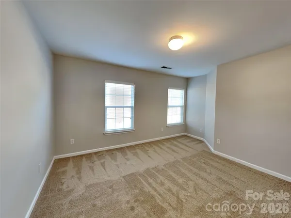 a spacious bathroom with a tub a double vanity sink and mirrors