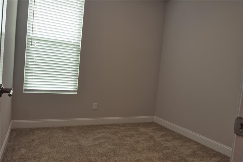 6120 Ripple Way, Unit 46 Atlanta, GA 30349 - Photo 19 of 19 a room that has a window in it