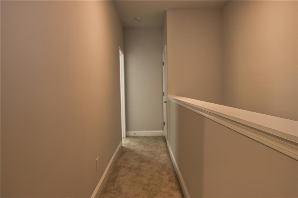 6120 Ripple Way, Unit 46 Atlanta, GA 30349 - Photo 9 of 19 a view of hallway with closet