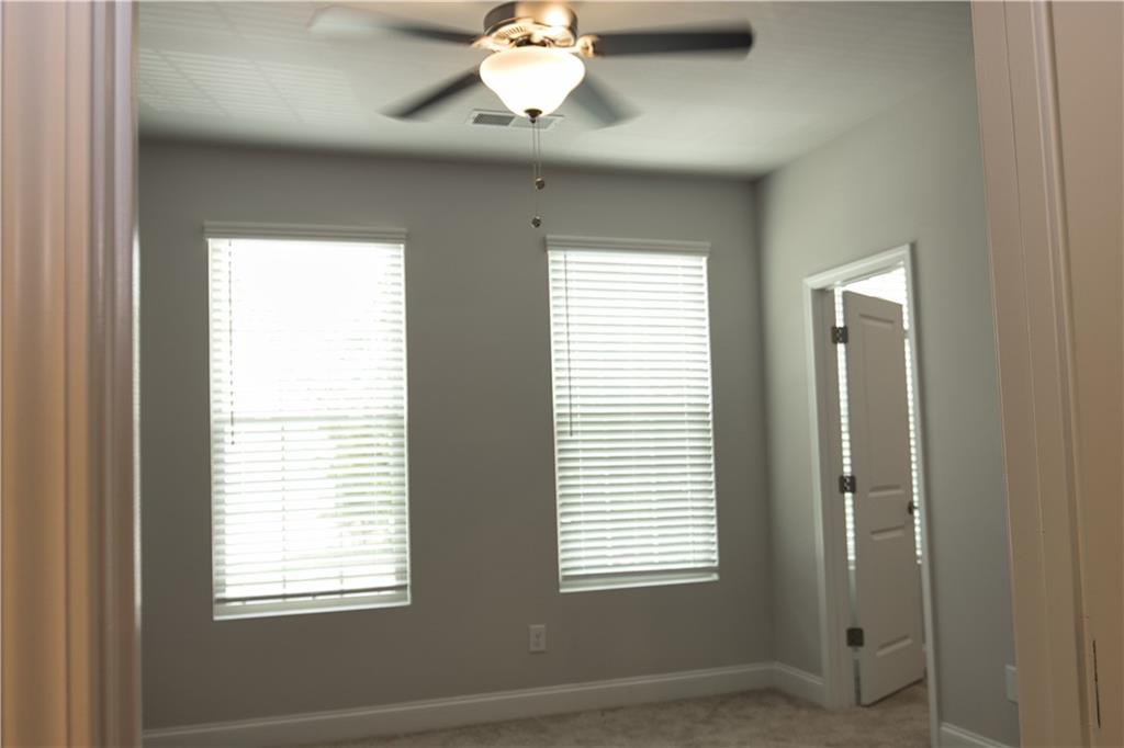 6120 Ripple Way, Unit 46 Atlanta, GA 30349 - Photo 10 of 19 a view of an empty room with a window