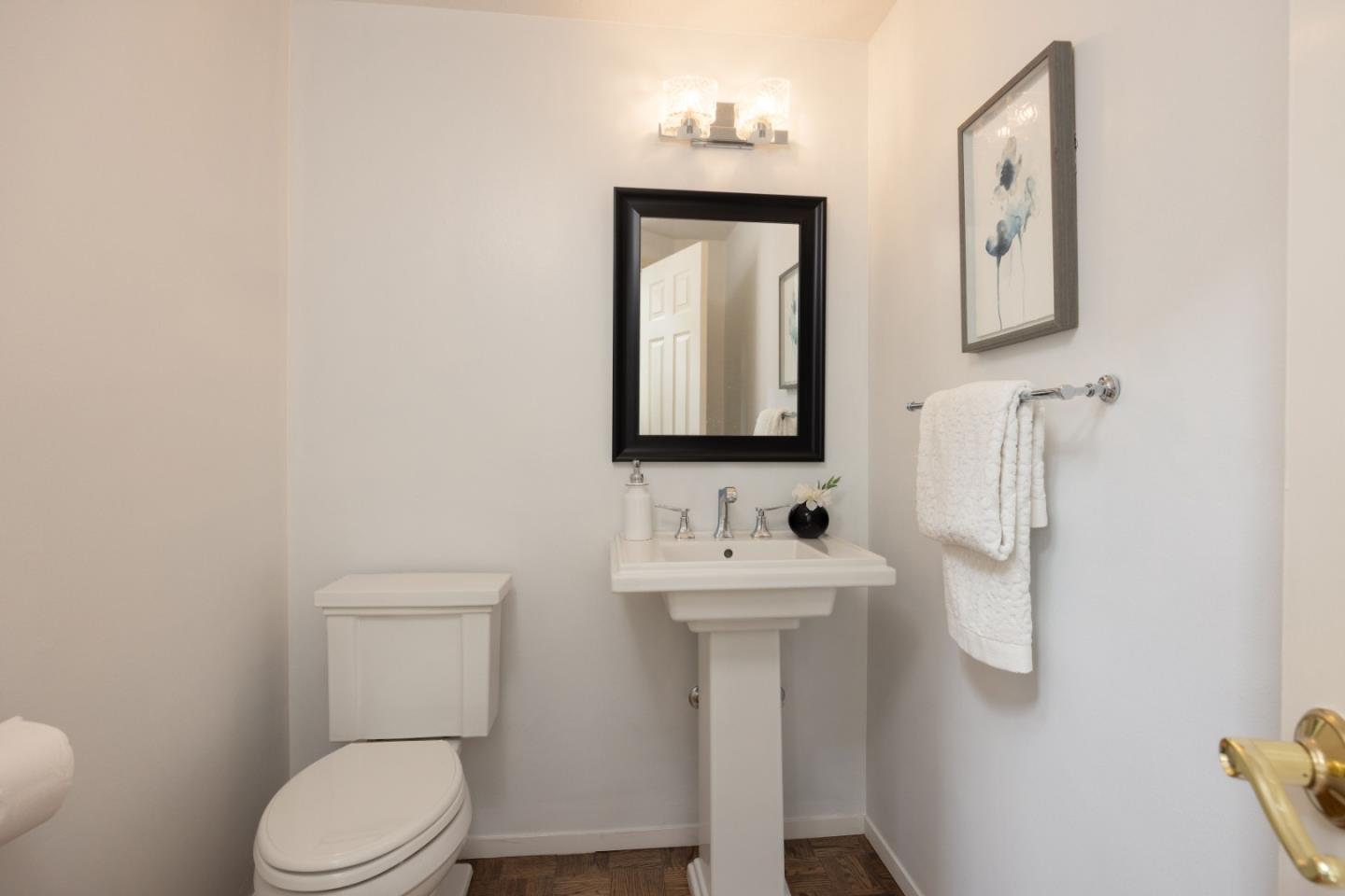 21 Pinehurst Lane Half Moon Bay, CA 94019 - Photo 17 of 43 a bathroom with a toilet sink and mirror