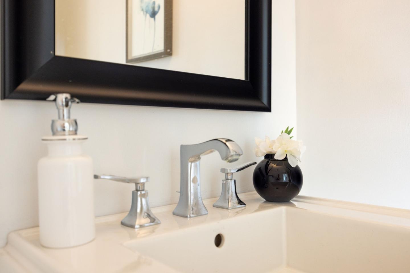 21 Pinehurst Lane Half Moon Bay, CA 94019 - Photo 18 of 43 a close view of a sink and a mirror