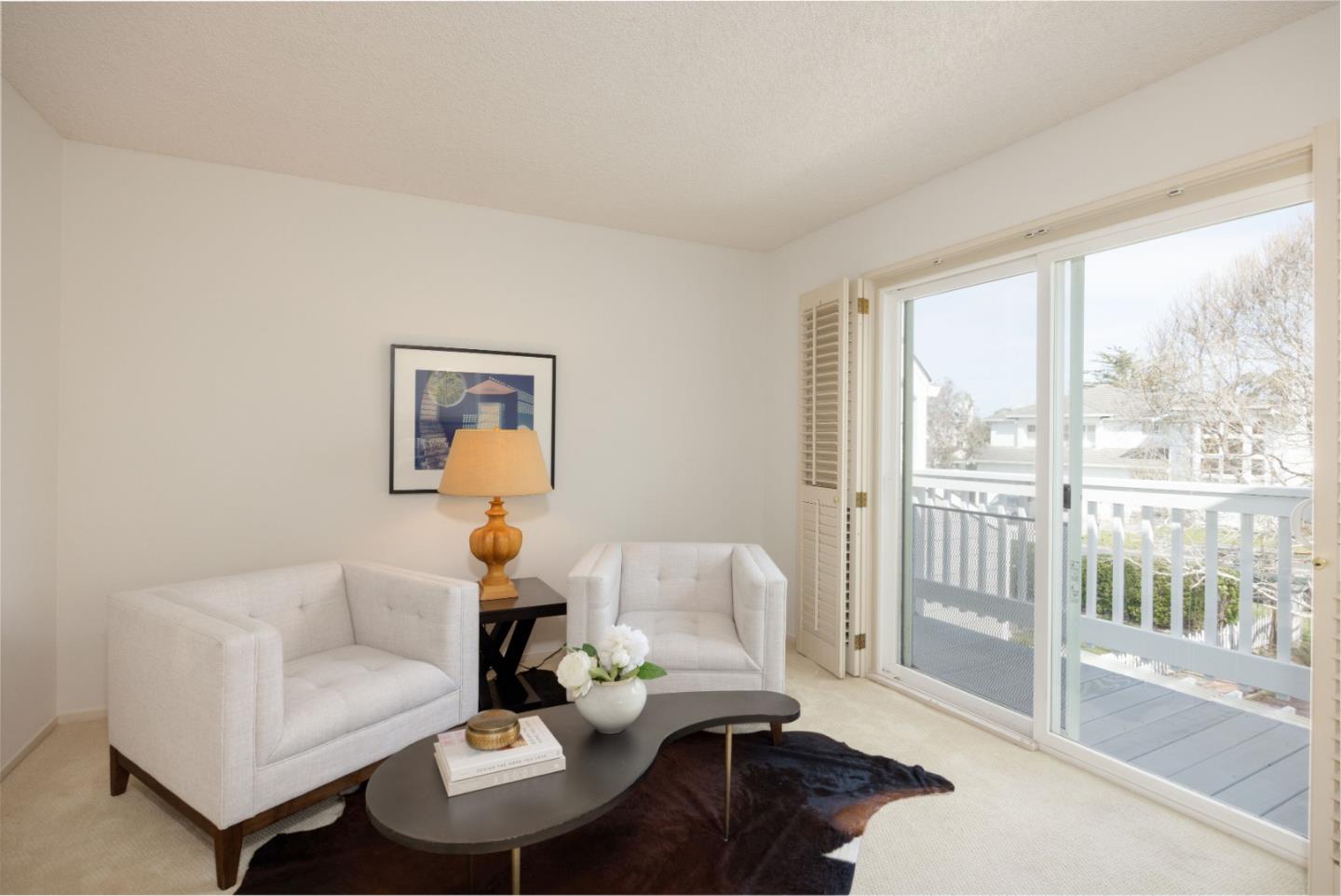 21 Pinehurst Lane Half Moon Bay, CA 94019 - Photo 19 of 43 a living room with furniture and a large window